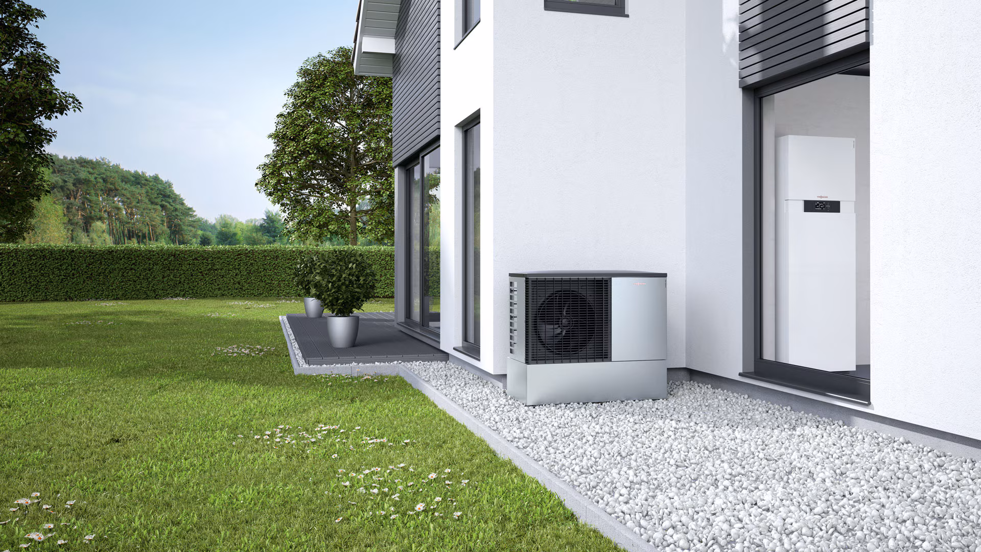 Luft-Wasser-Wärmepumpe an modernem Einfamilienhaus mit Förderung für energieeffizientes Heizen 2026